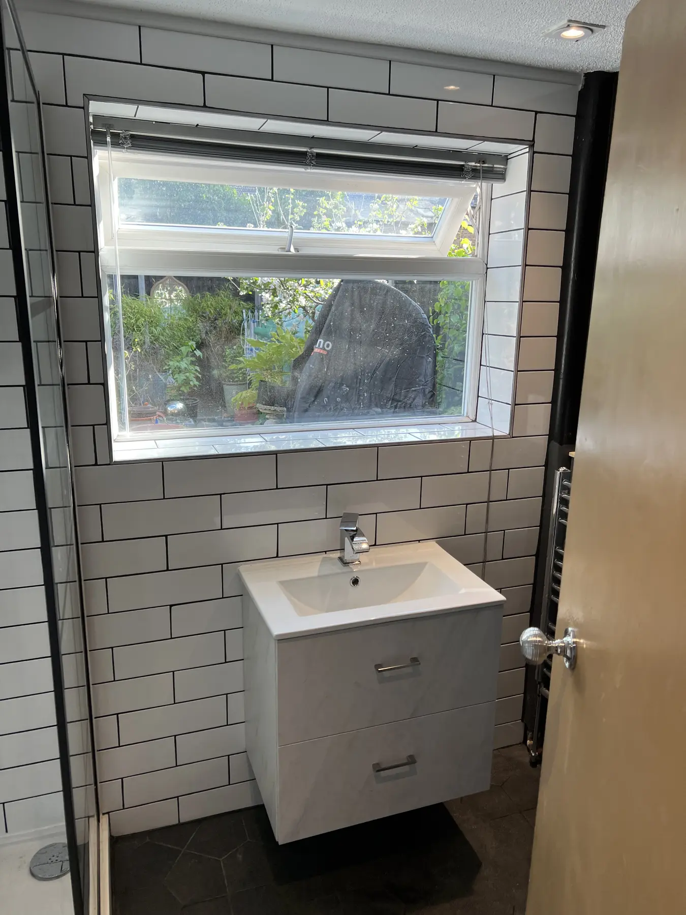 Bathroom vanity and grey tiles