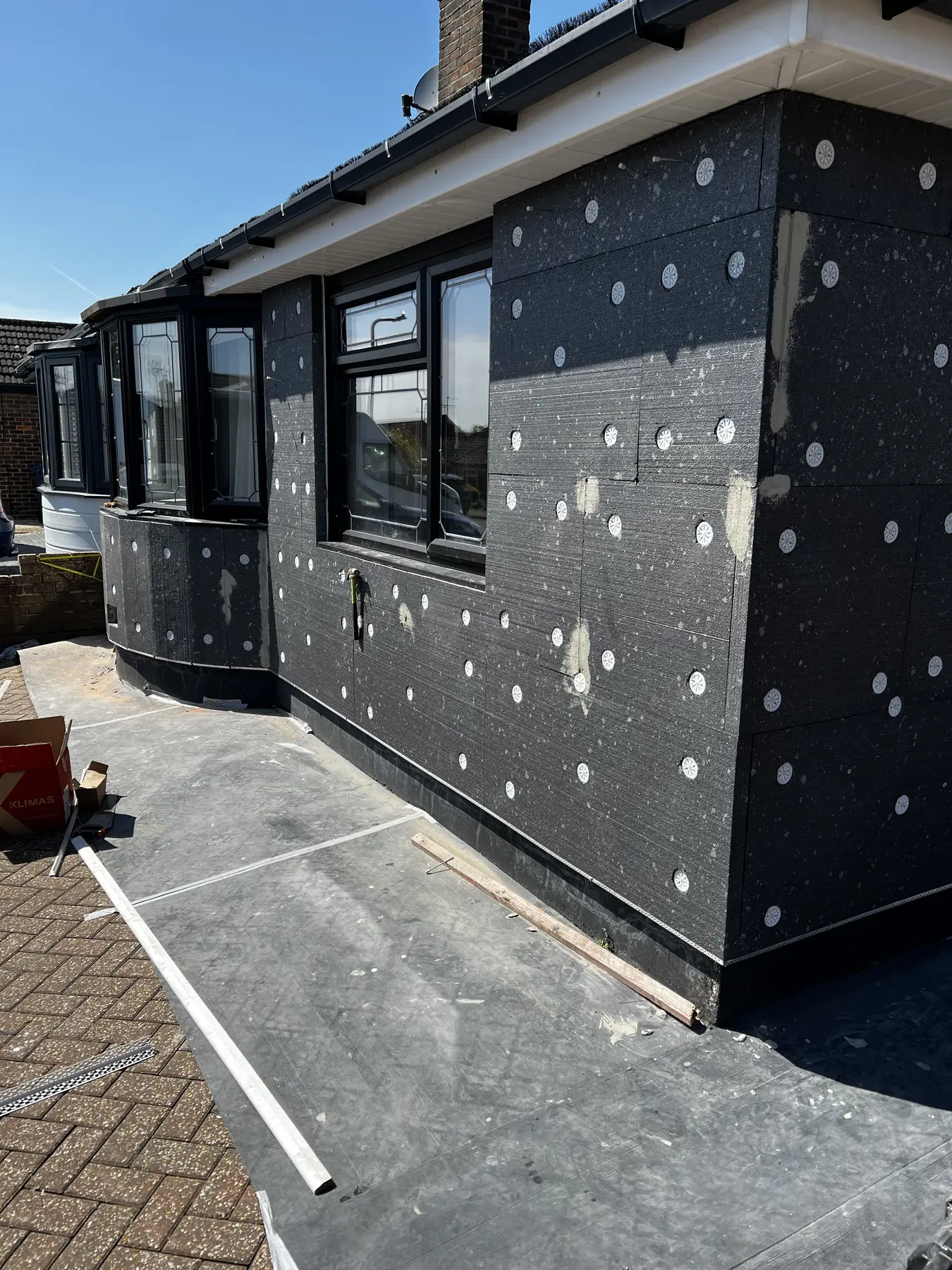 T&T Contractors carrying out external insulation installation work
