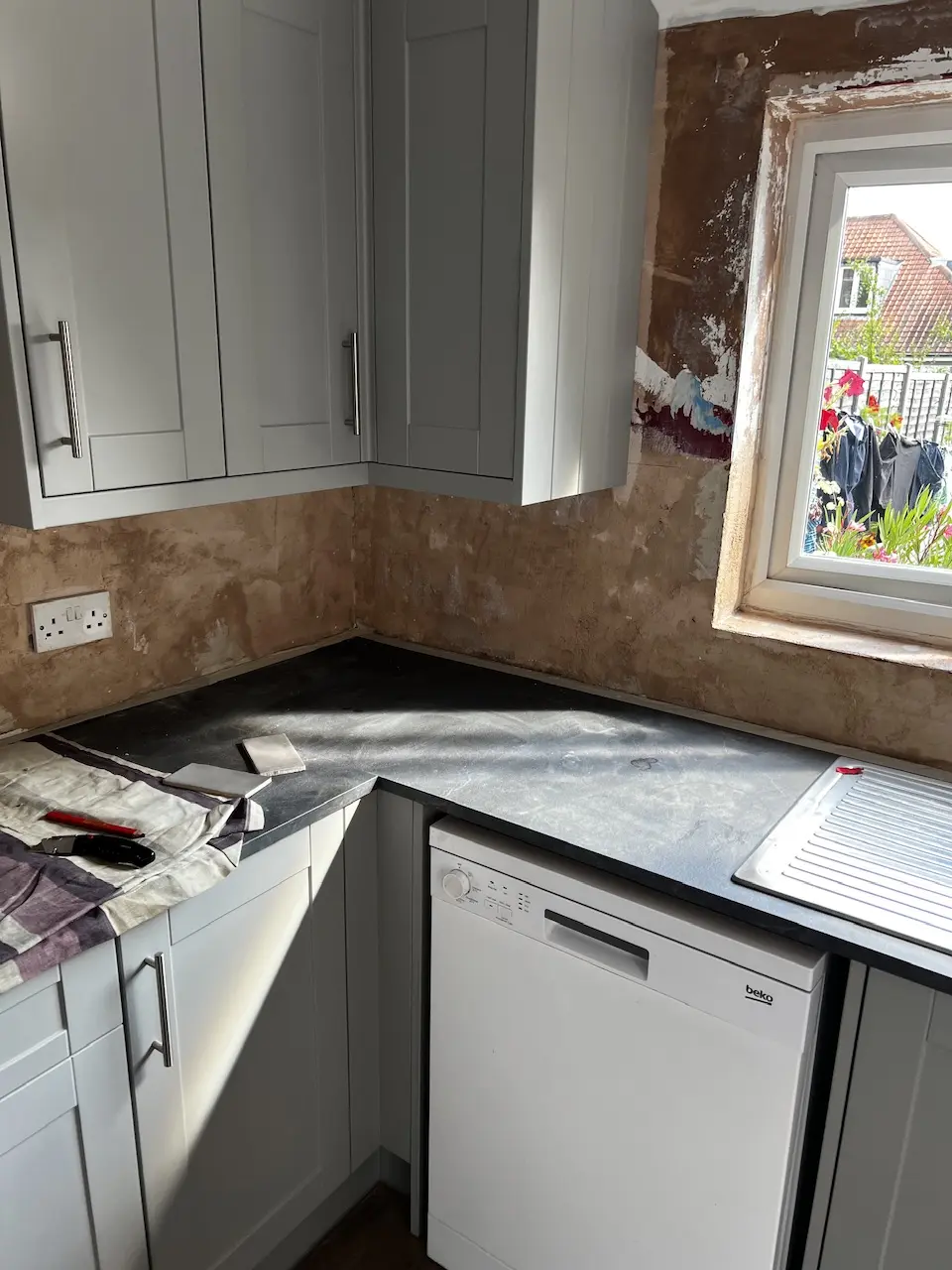 Grey kitchen worktop and cabinets