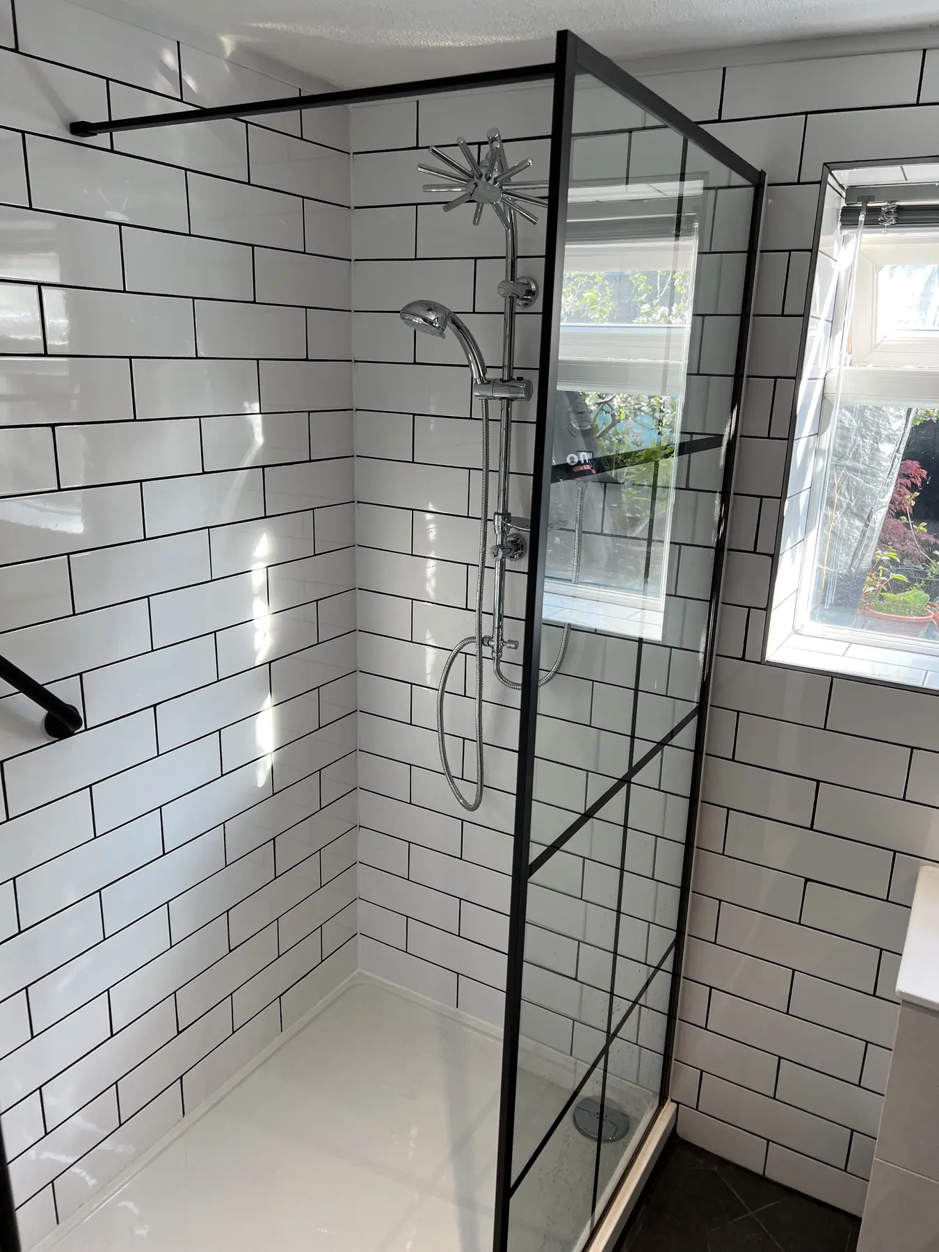 Walk-in shower with black frame