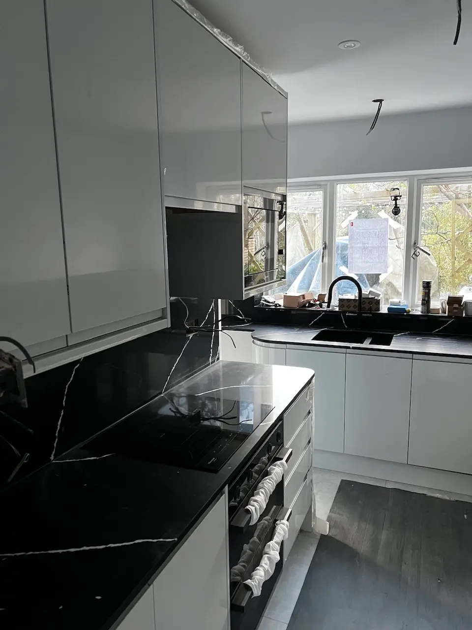 White kitchen with integrated appliances